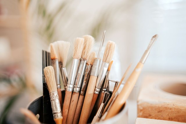 An image of paintbrushes in a can