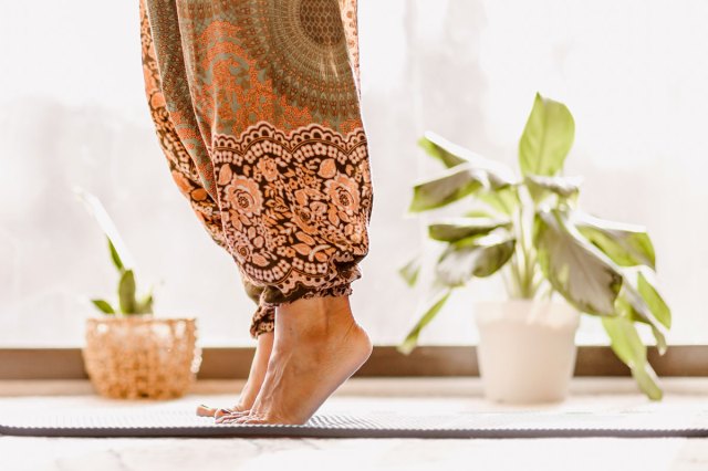 An image of a woman standing on her toes