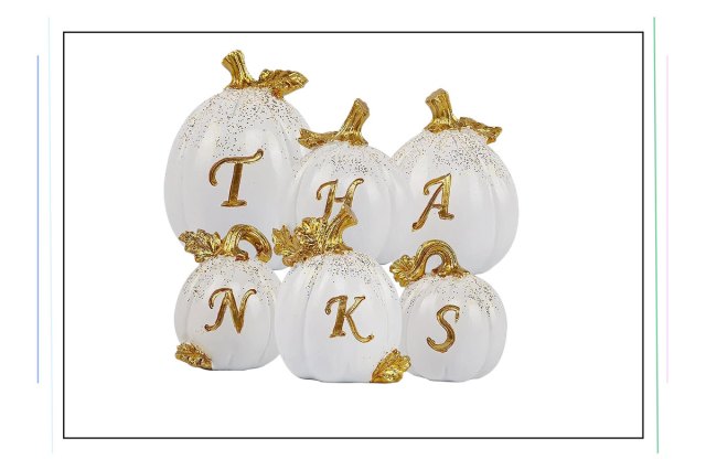 An image of white pumpkins that spell "Thanks" in gold